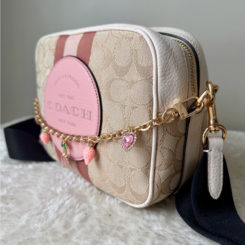 Coach Dempsey camera bag in beige and pink with Coach patch and chain charm